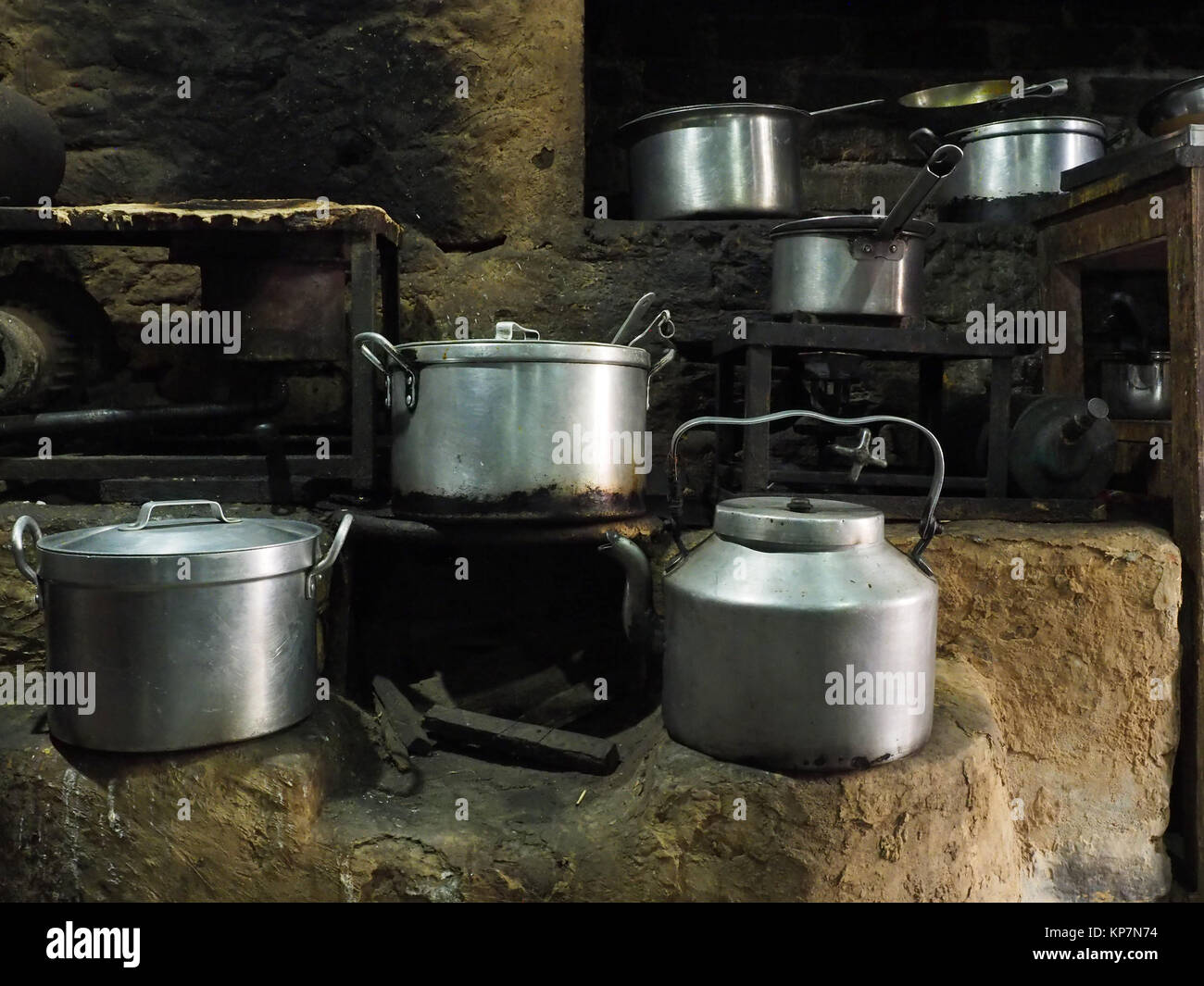 https://c8.alamy.com/comp/KP7N74/metal-dishes-huge-aluminum-pots-and-chalices-stand-in-disorder-on-KP7N74.jpg
