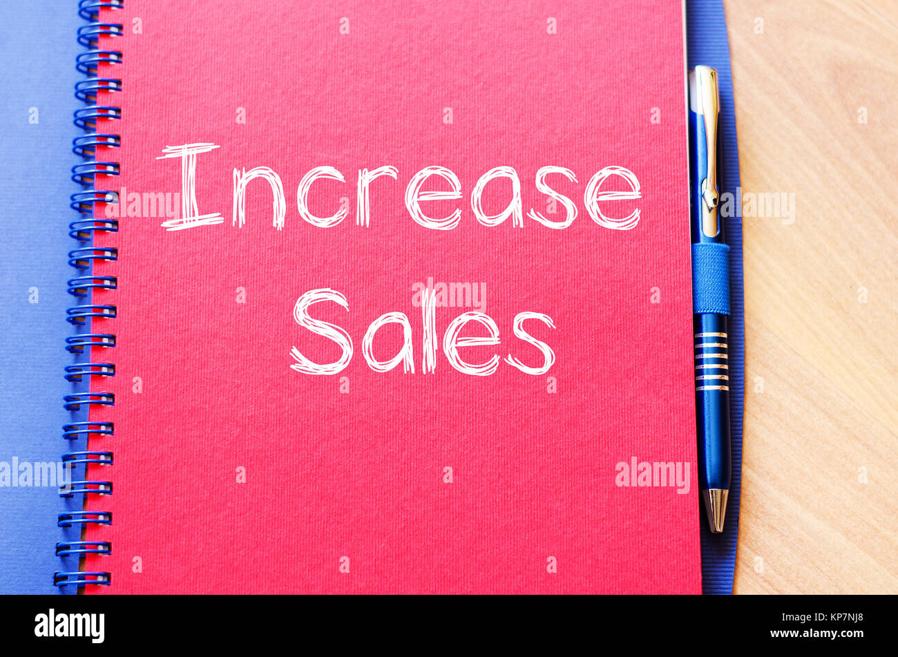Increase sales write on notebook Stock Photo Alamy