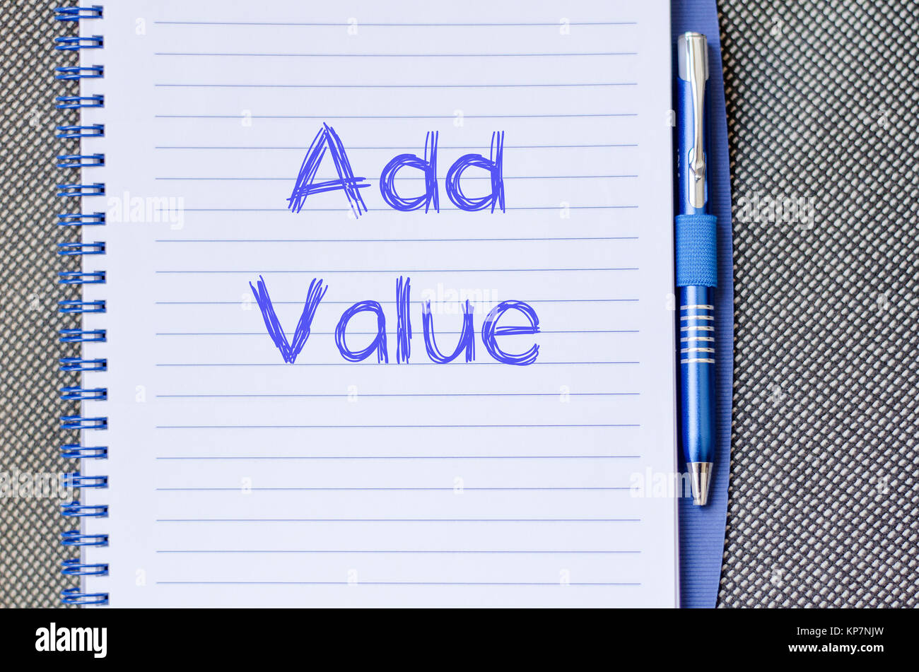 Add value write on notebook Stock Photo - Alamy