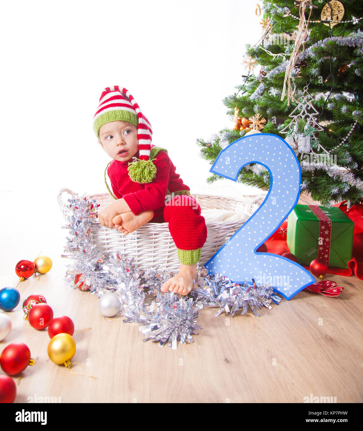 Baby boy dressed as elf Stock Photo