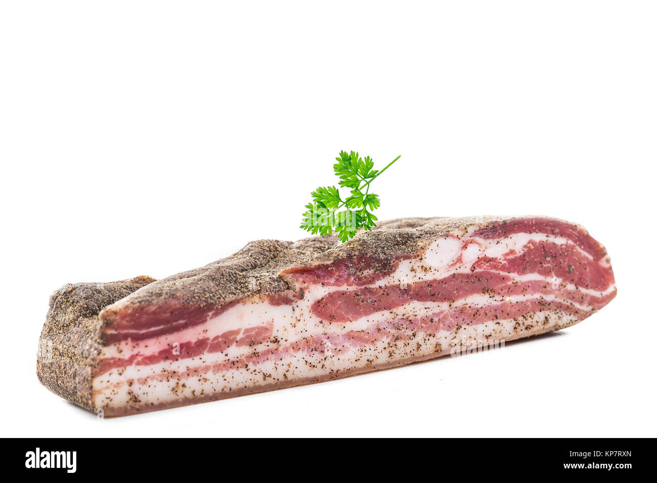 Corsican traditional delicatess smoked piece of pork or boar belly on a white background Stock Photo