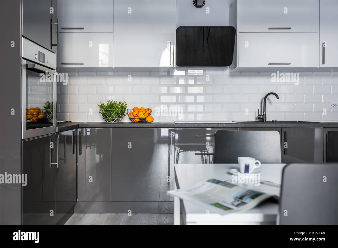 High gloss white and gray cabinets in modern kitchen Stock Photo