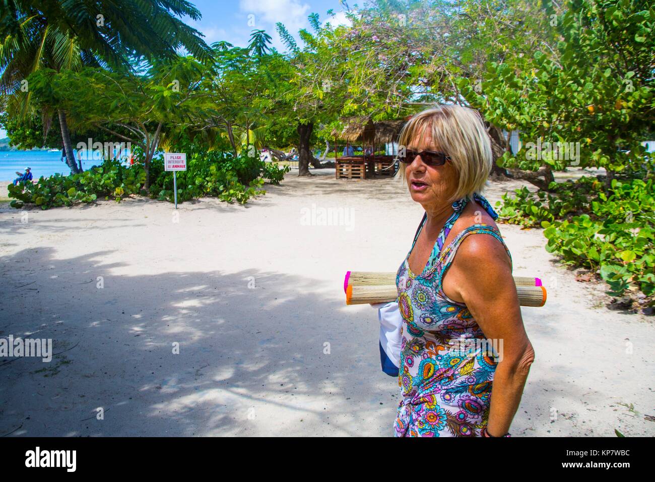 Older mature senior caucasian retired couple going to the beach and