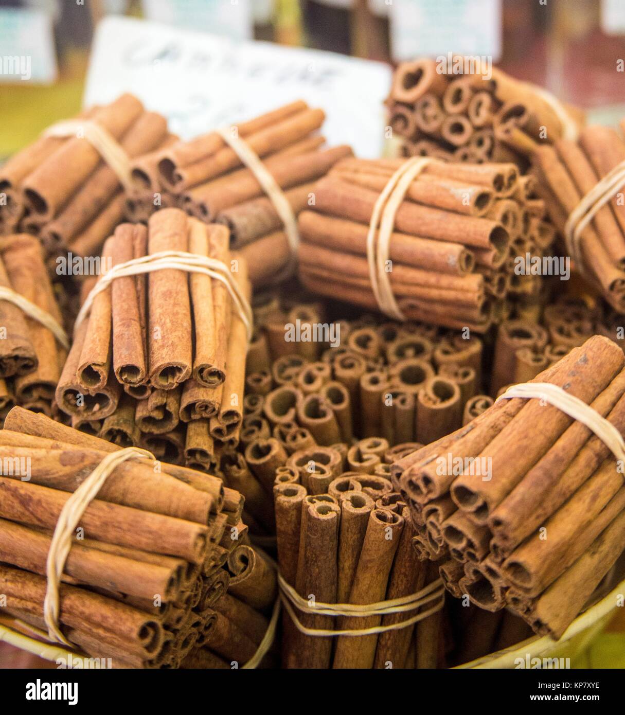 Cinnamon sticks bundle together for sale in a Martinique market. They