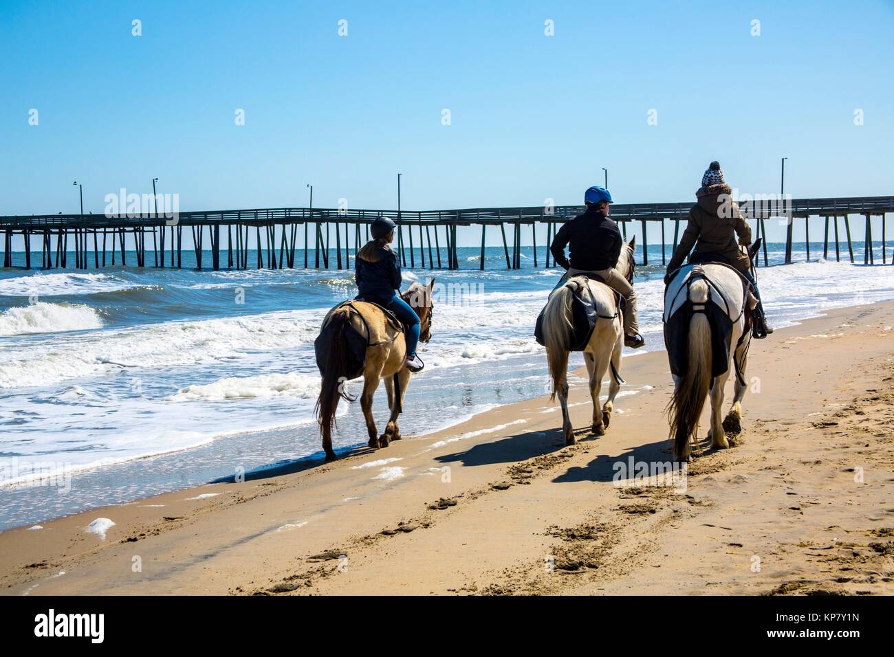 Virginia Beach boardwalk along the ocean, where people can ride horses