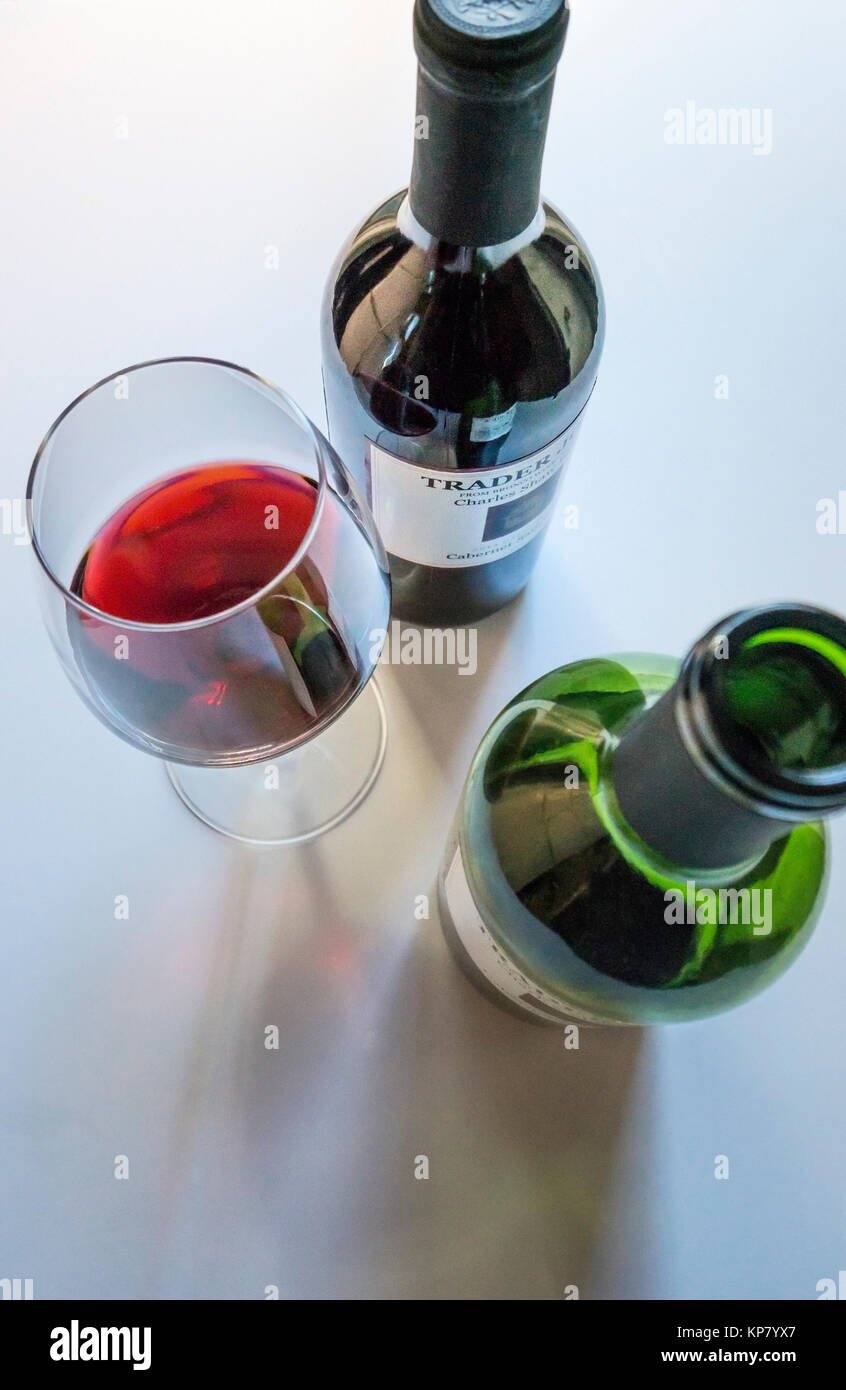 Tow bottles of Cabernet Sauvignon red wine and a pour in a stemmed glass Stock Photo