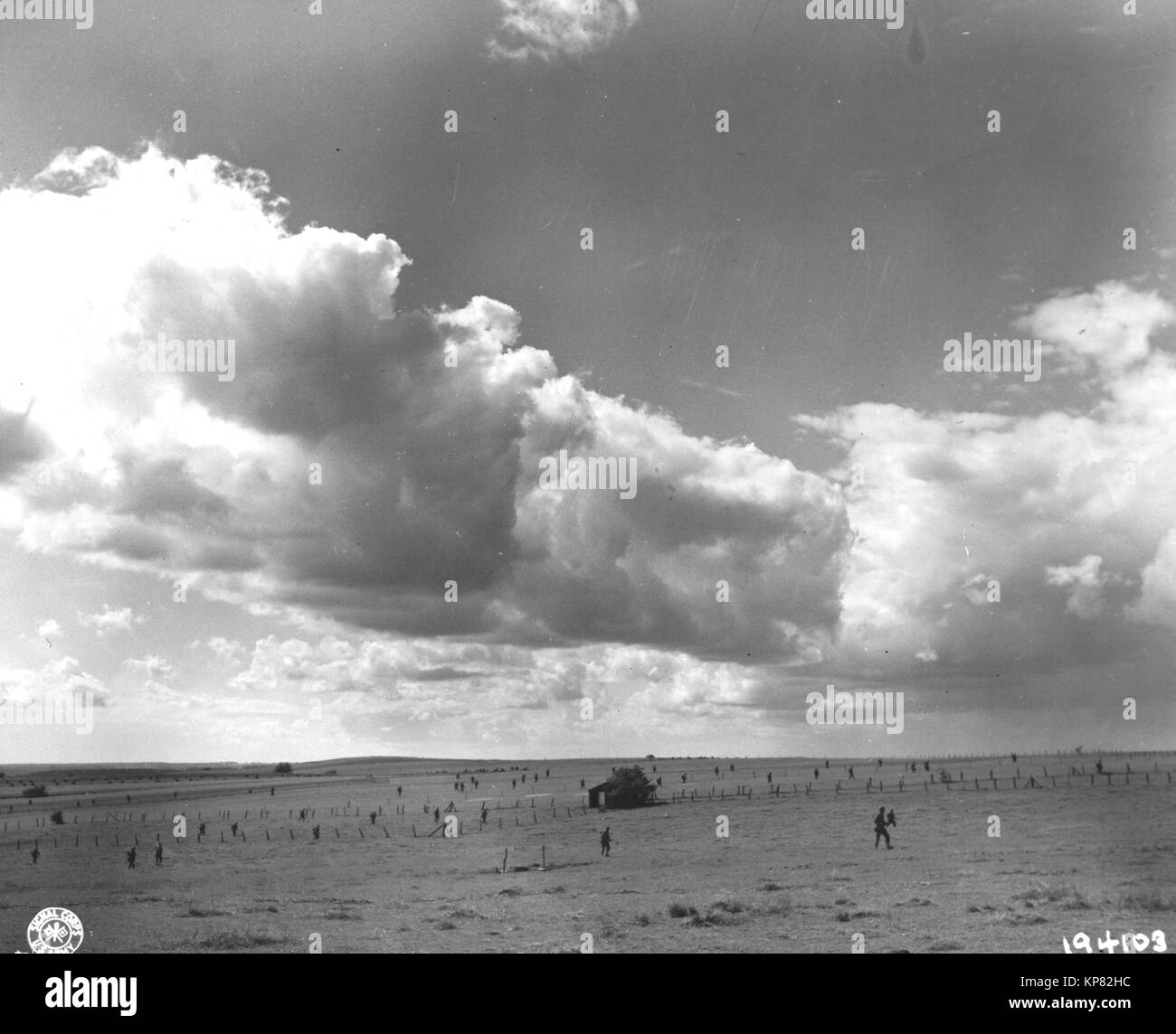 U.S. Troops during World War II push their way across farmland near  Habay-La-Neuve Belgium September 12, 1944 Stock Photo