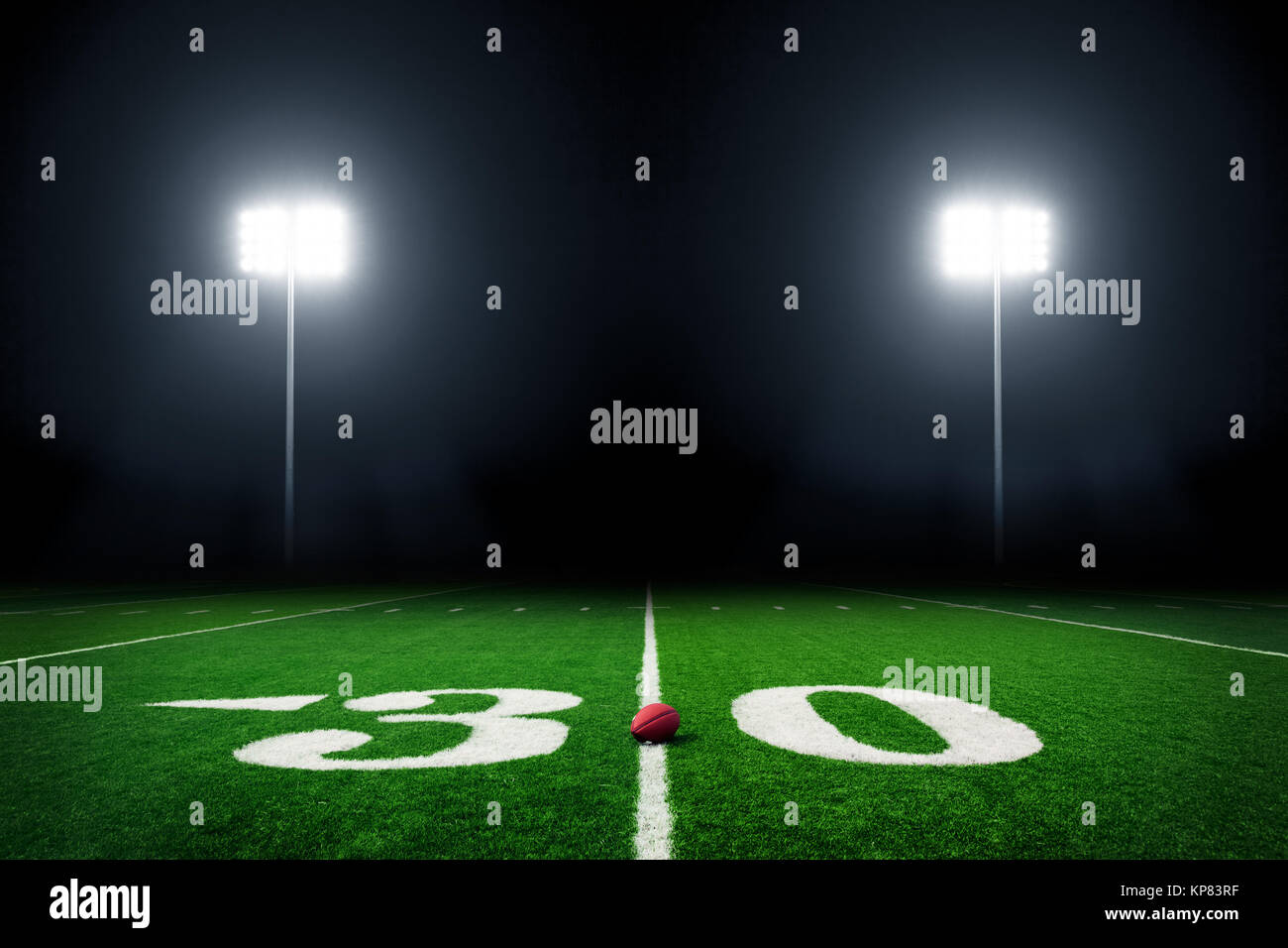 Football field illuminated by stadium lights Stock Photo Alamy