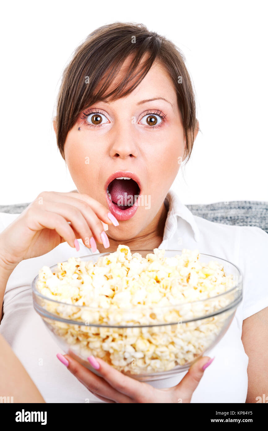 Young woman eating popcorn Stock Photo Alamy