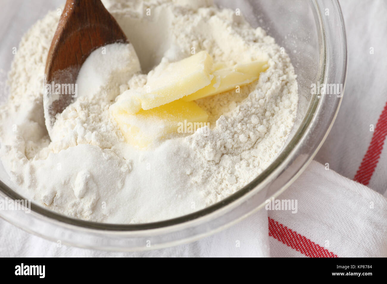 Combining butter with flour and sugar Stock Photo