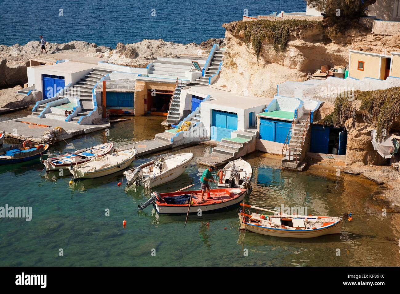 Fisherman in his boat in front of the fisherman houses with boat