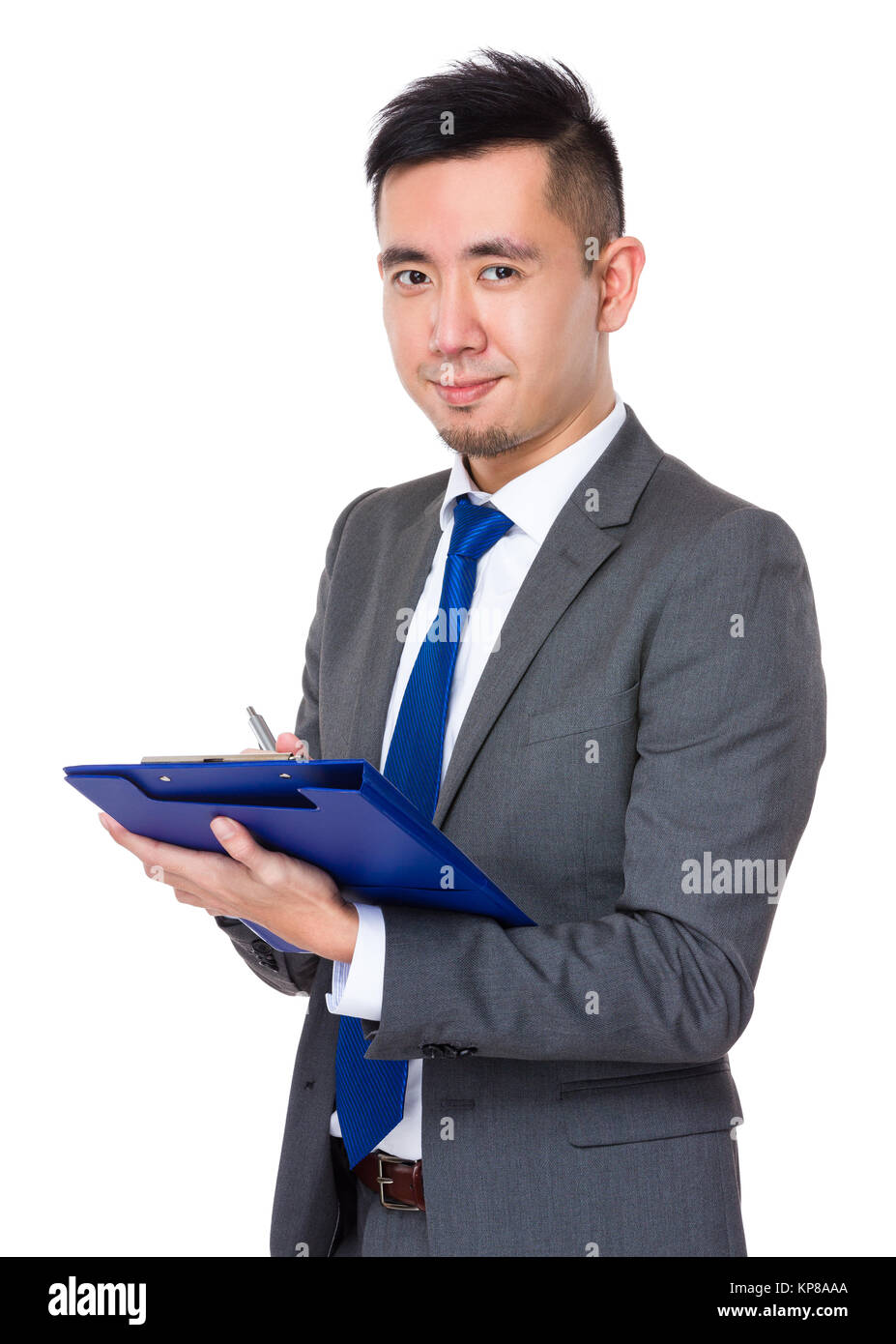 Asian Young Businessman take note on clipboard Stock Photo - Alamy