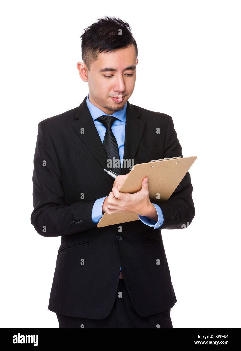 Young Businessman take note on clipboard Stock Photo - Alamy