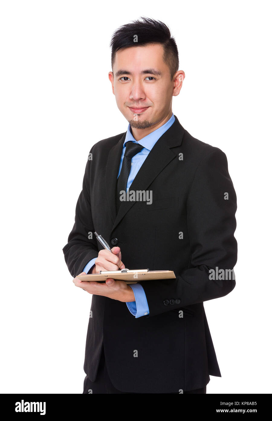 Asian Young Businessman write on clipboard Stock Photo - Alamy