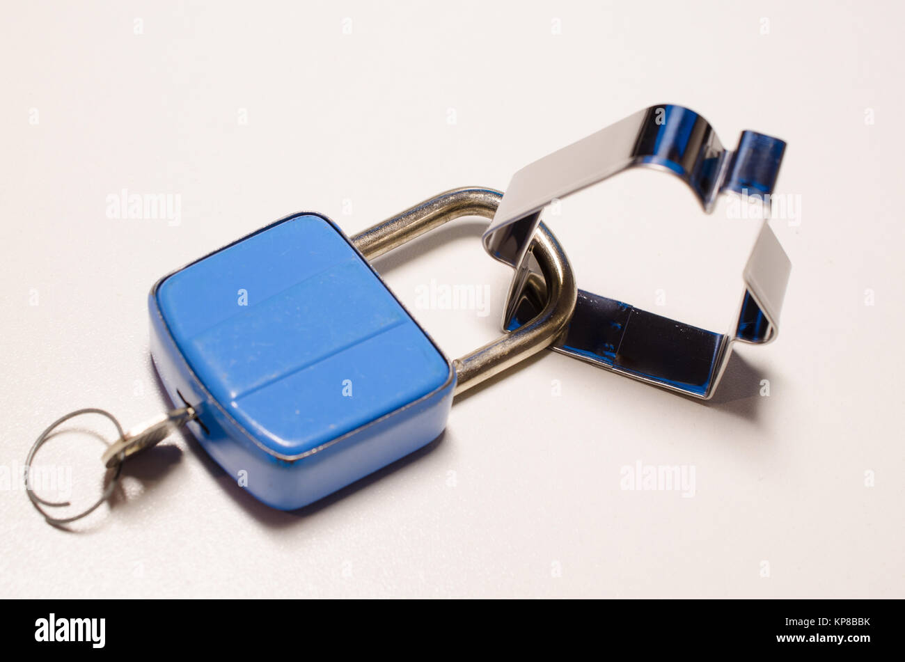 House shape with an old blue padlock, safety concept Stock Photo Alamy
