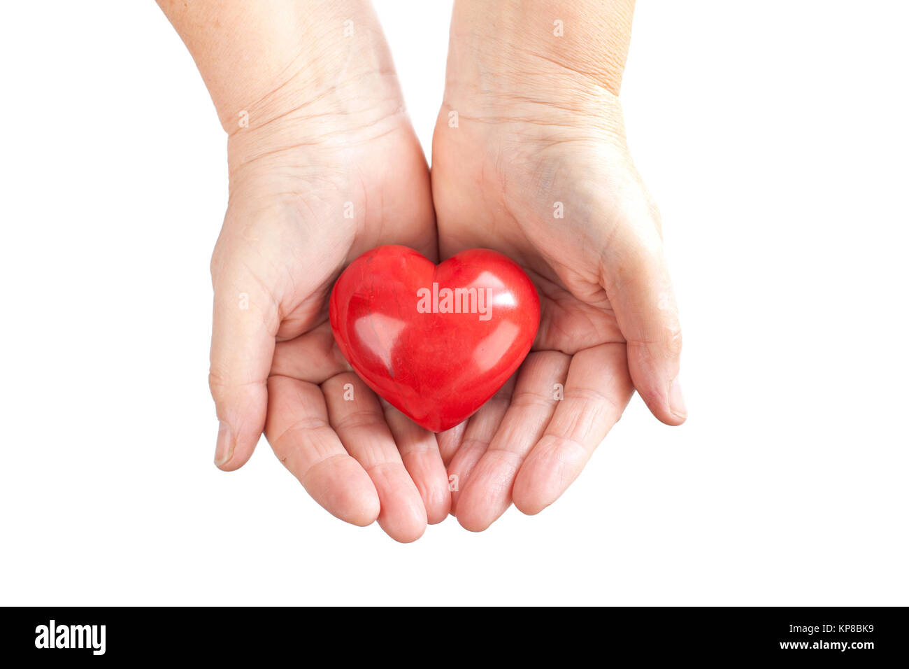 Hands hold red heart Stock Photo