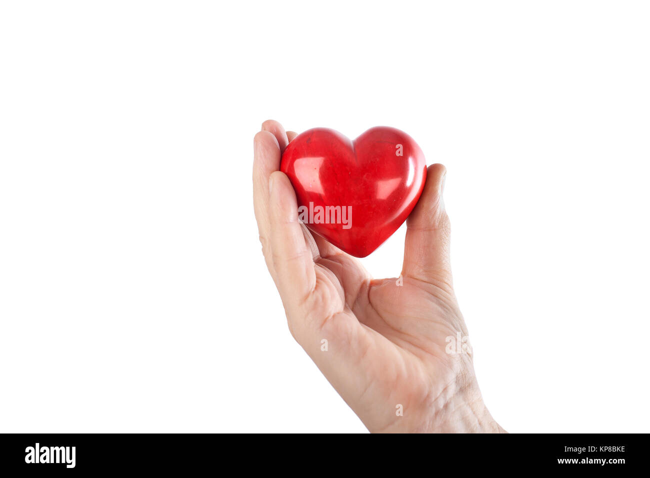 Hands hold red heart Stock Photo