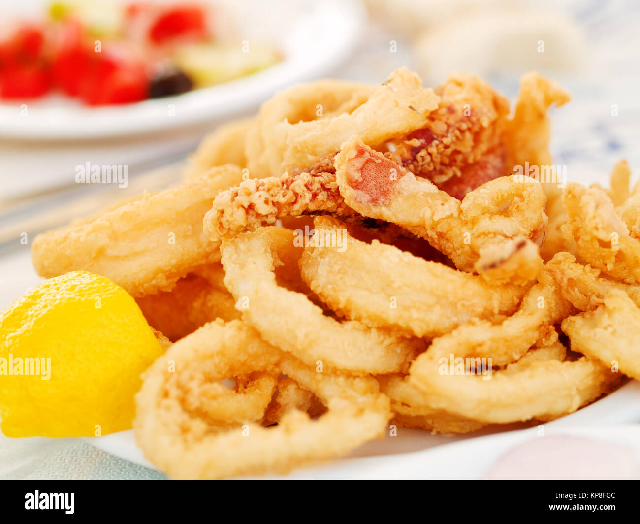Fried squid in a greek restaurant Stock Photo - Alamy