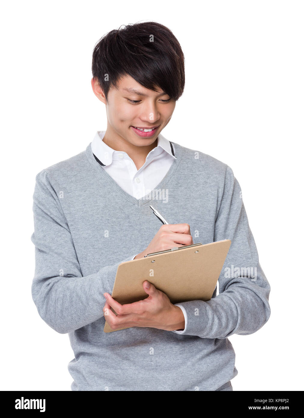 Asian Businessman write on clipboard Stock Photo - Alamy