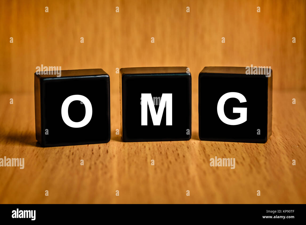 OMG or Oh My God word on black block Stock Photo