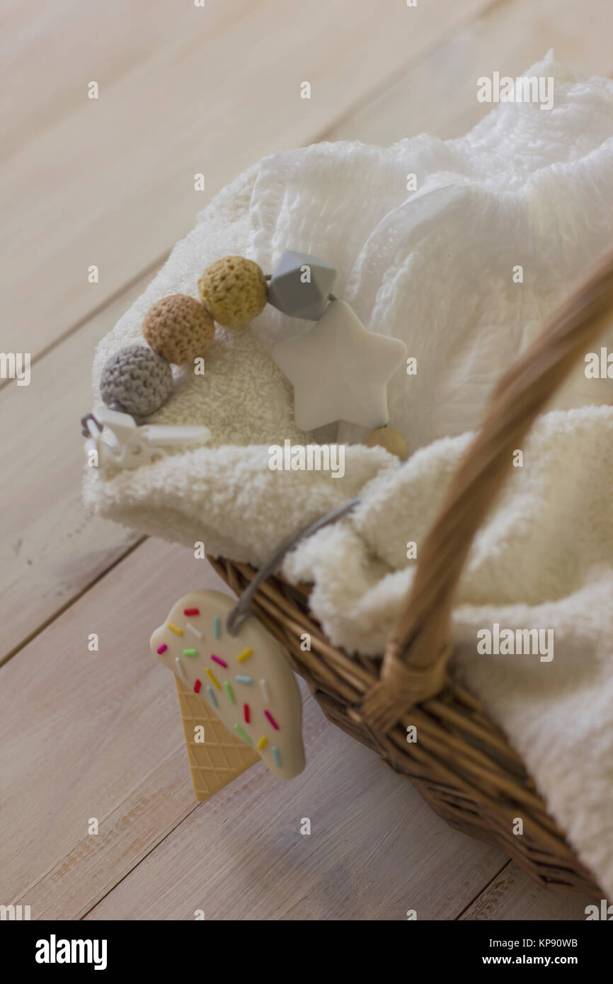 Disposable diapers on towel in wicker basket. Delicate still life