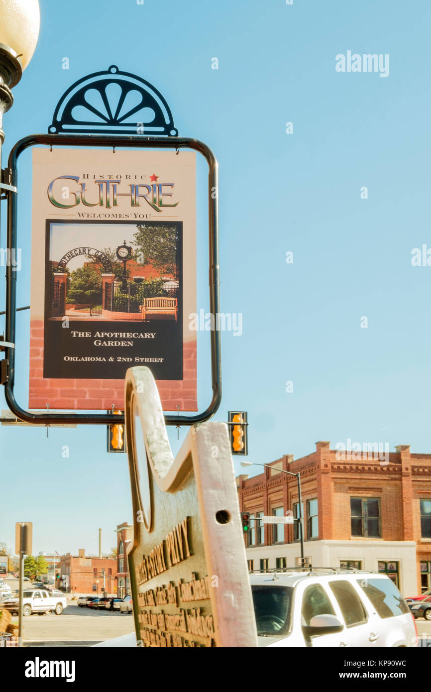 A sign welcoming visitors to Historic Guthrie, Oklahoma, USA. Advertising the Apothecary Garden. Stock Photo