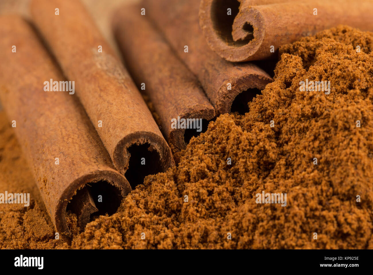 Cinnamon sticks with powder Stock Photo Alamy