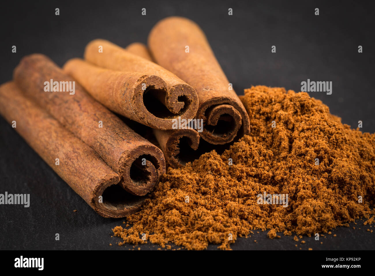 Cinnamon sticks with powder Stock Photo Alamy