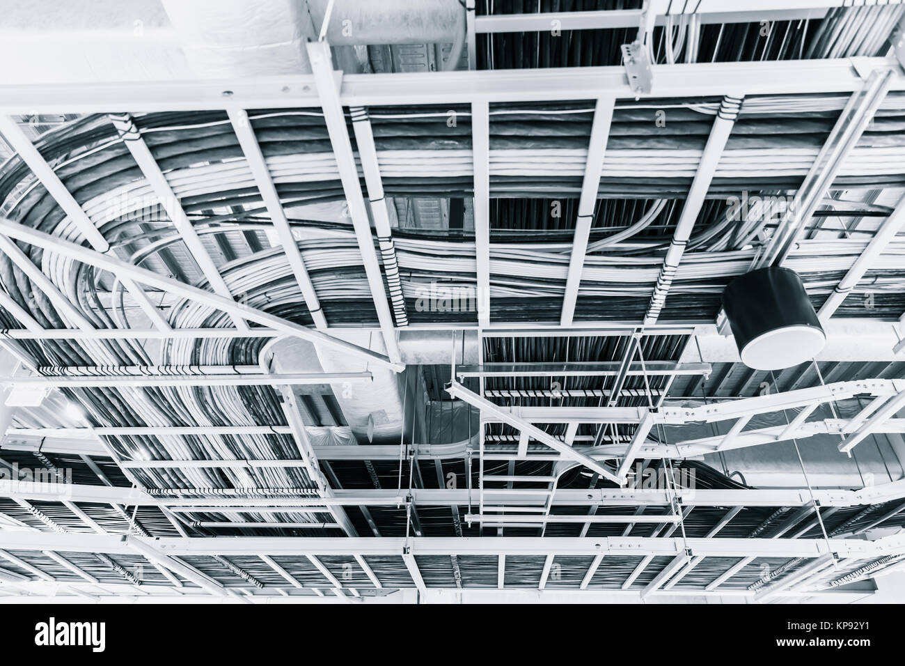 data and electrical communication cables in a cableway on the roof Stock Photo