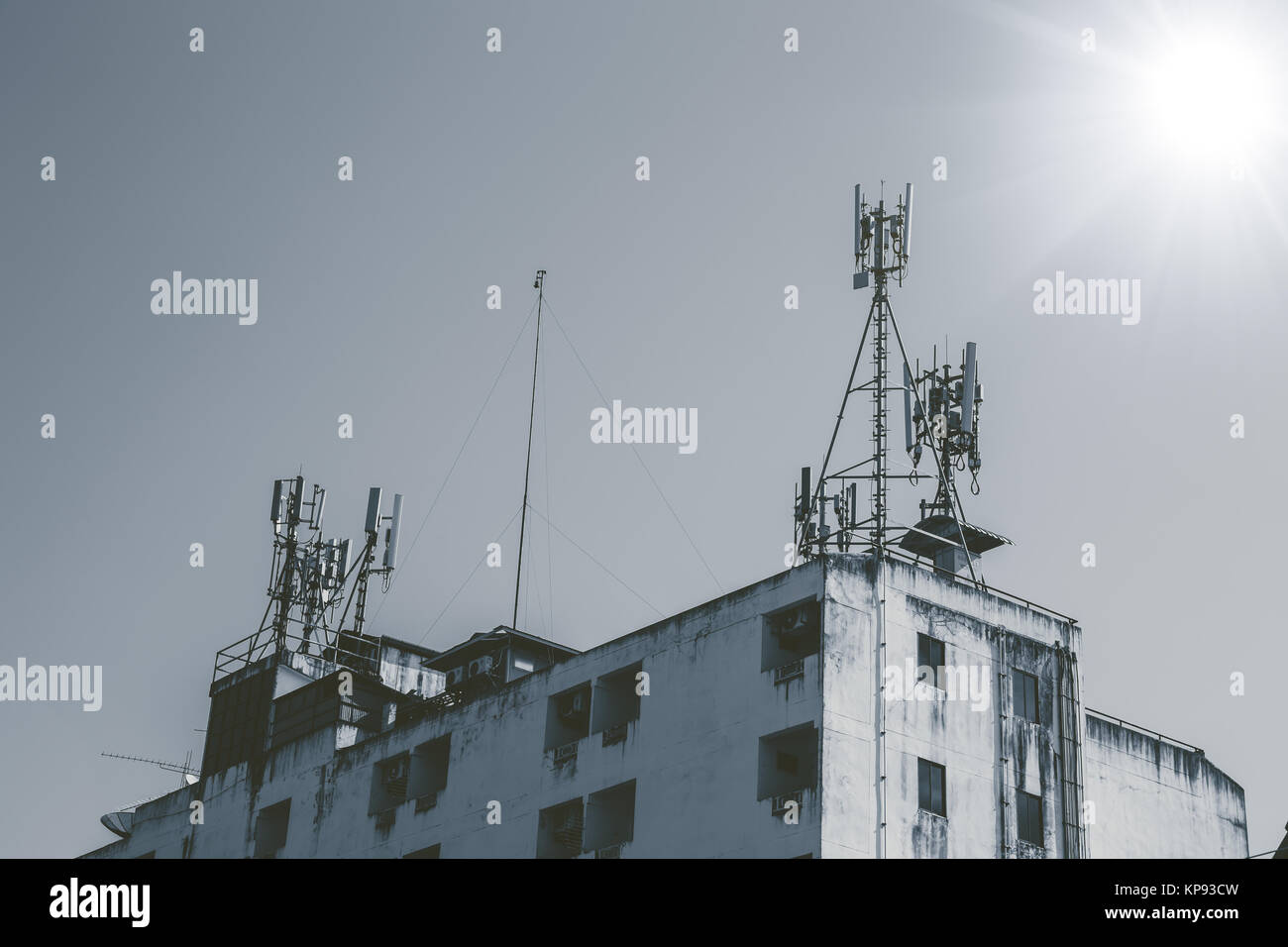 communication tower on top of old building telephone industry in poor country concept Stock Photo