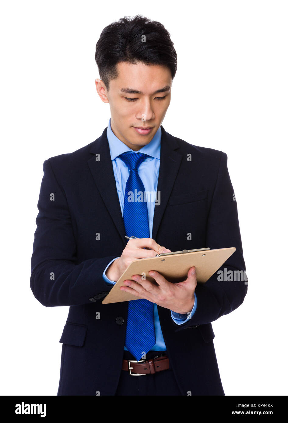 Asian businessman write on clipboard Stock Photo - Alamy