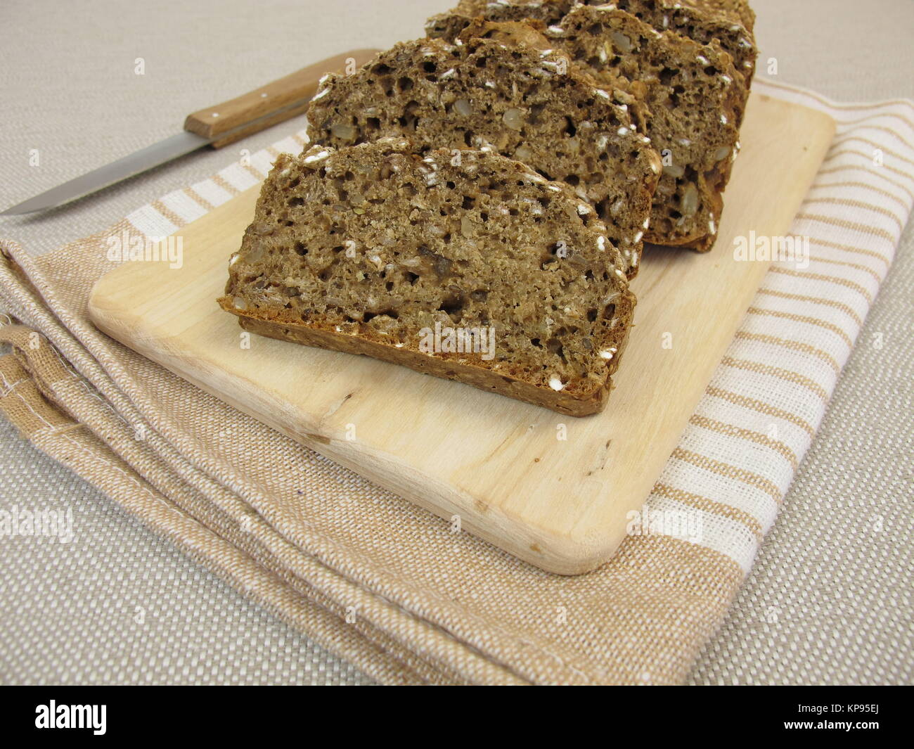 black bread with flaxseed and sunflower seeds Stock Photo