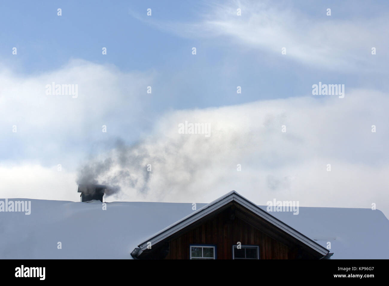 Wood heating - pollutants and soot from the fireplace Stock Photo