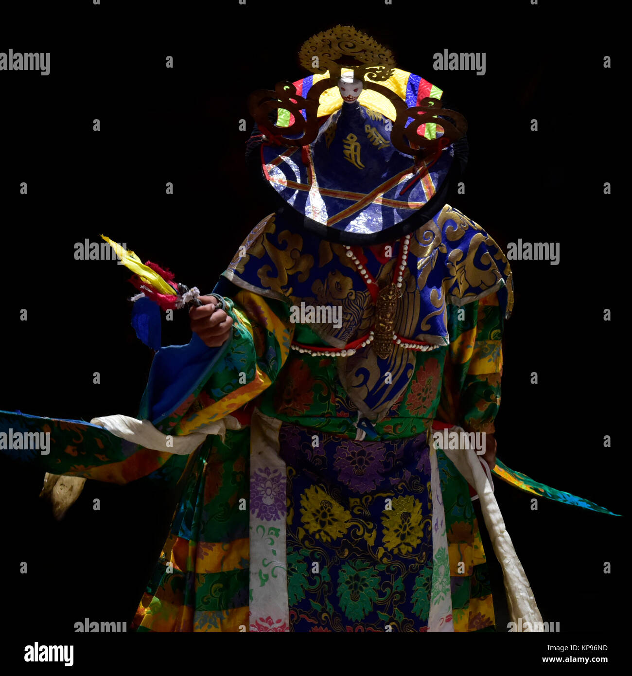 Buddhist monk in festive ritual clothing during a sacred ceremony in