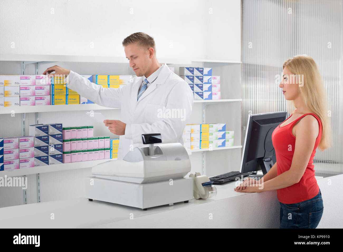 Pharmacist Reading Prescription Stock Photo Alamy