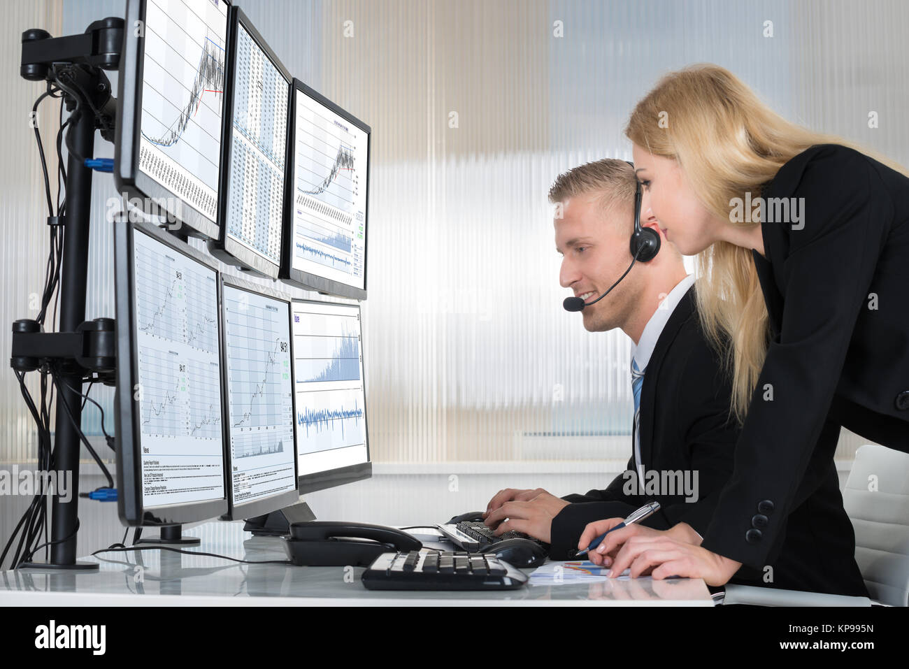 Business People Analyzing Data Displayed On Computer Screens Stock ...