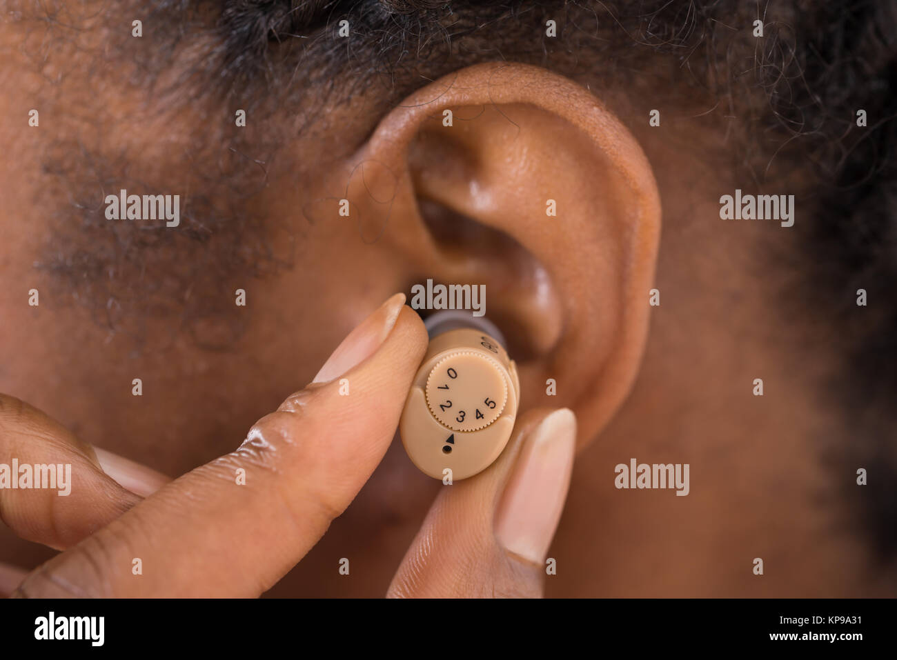 Hearing aid ear black hi-res stock photography and images - Alamy