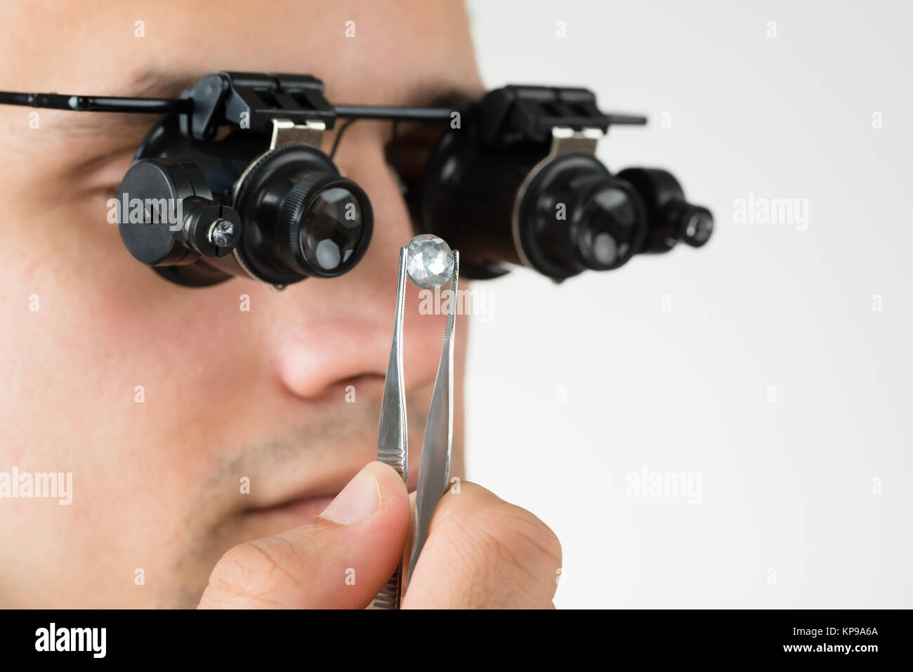 Jeweler Examining Diamond With Magnifying Loupe Stock Photo Alamy