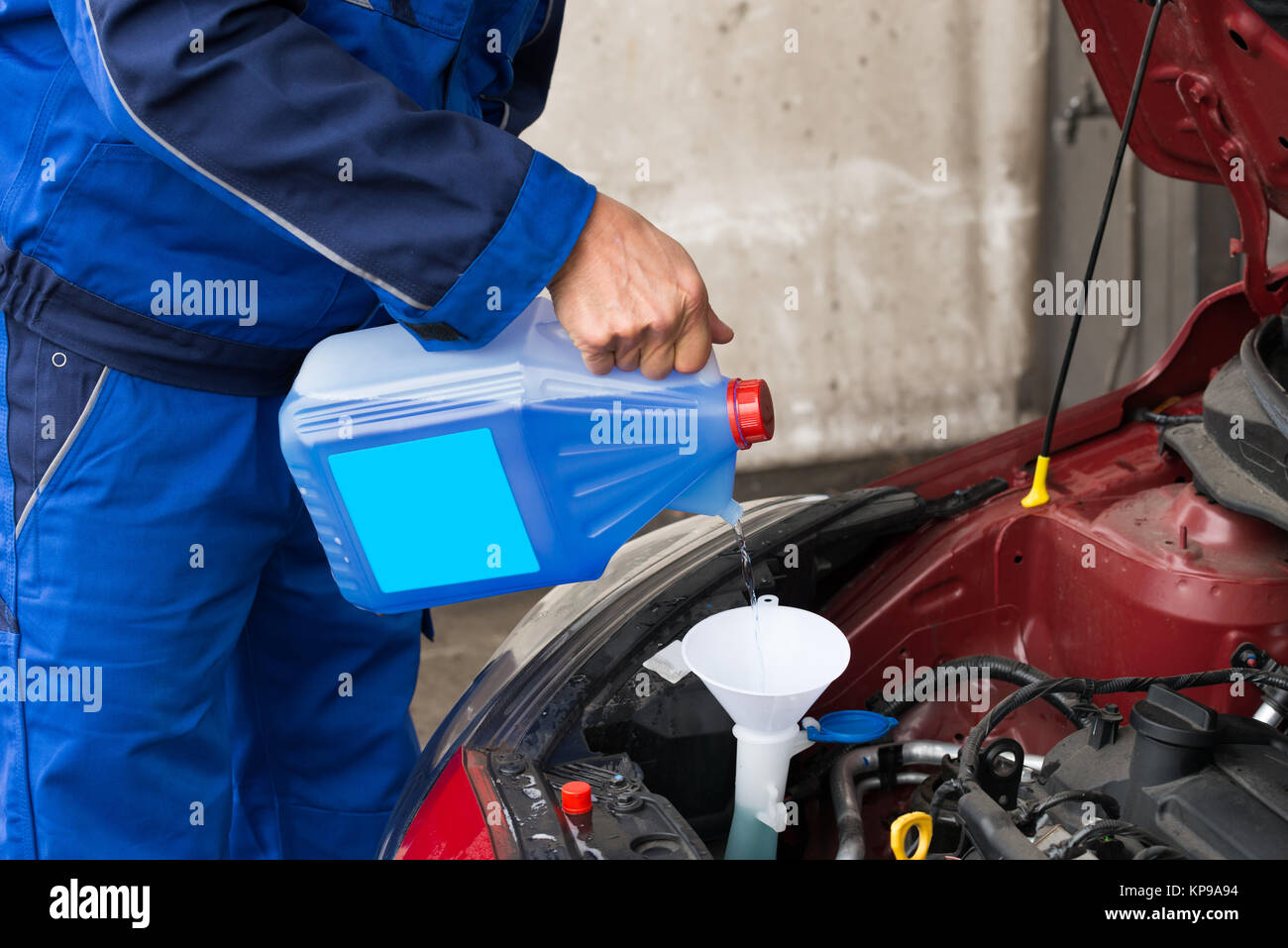 Serviceman Pouring Windshield Washer Fluid Into Car Stock Photo Alamy