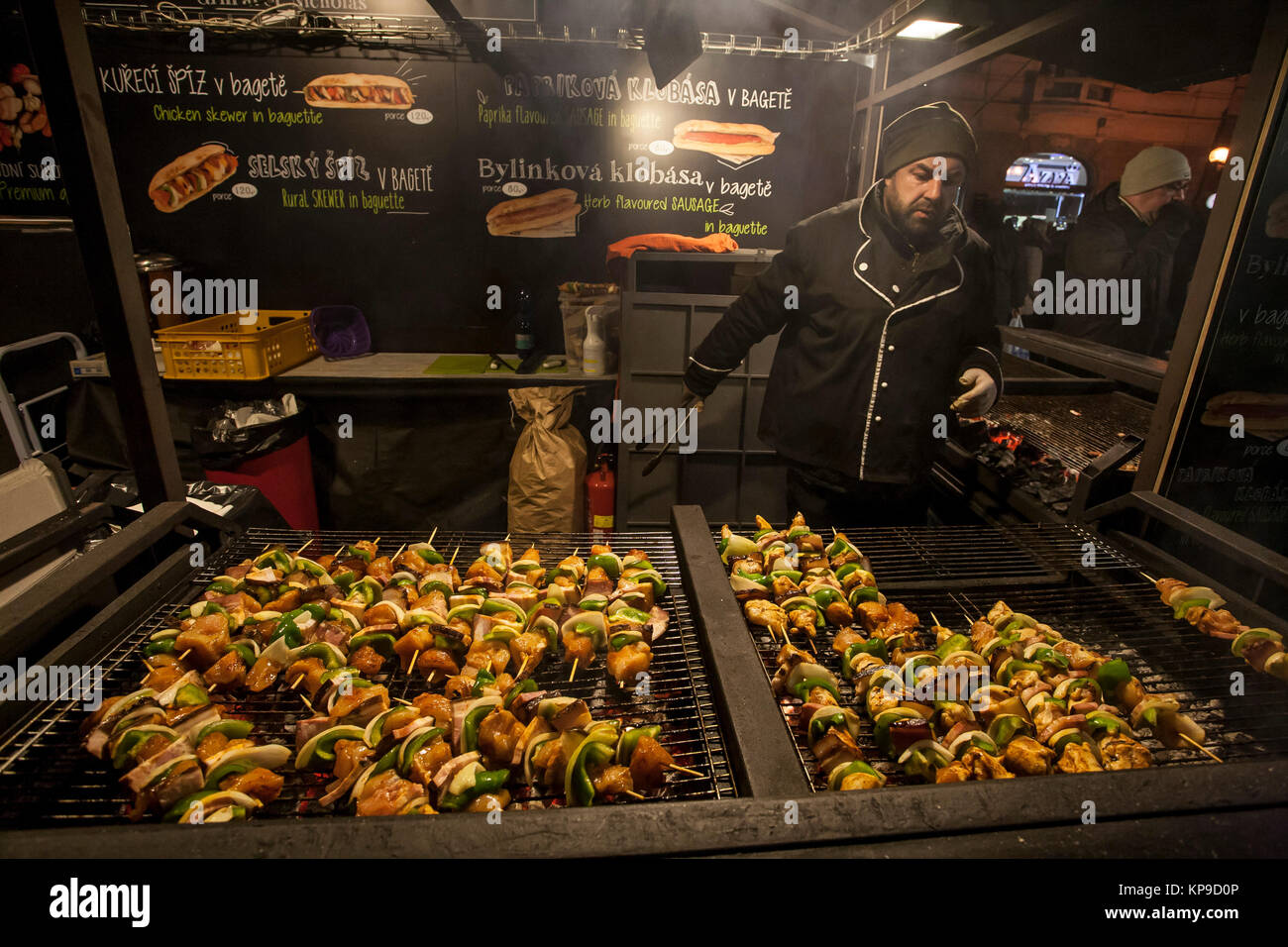 Christmas fast food kiosk with grilled meat at Old Town square in