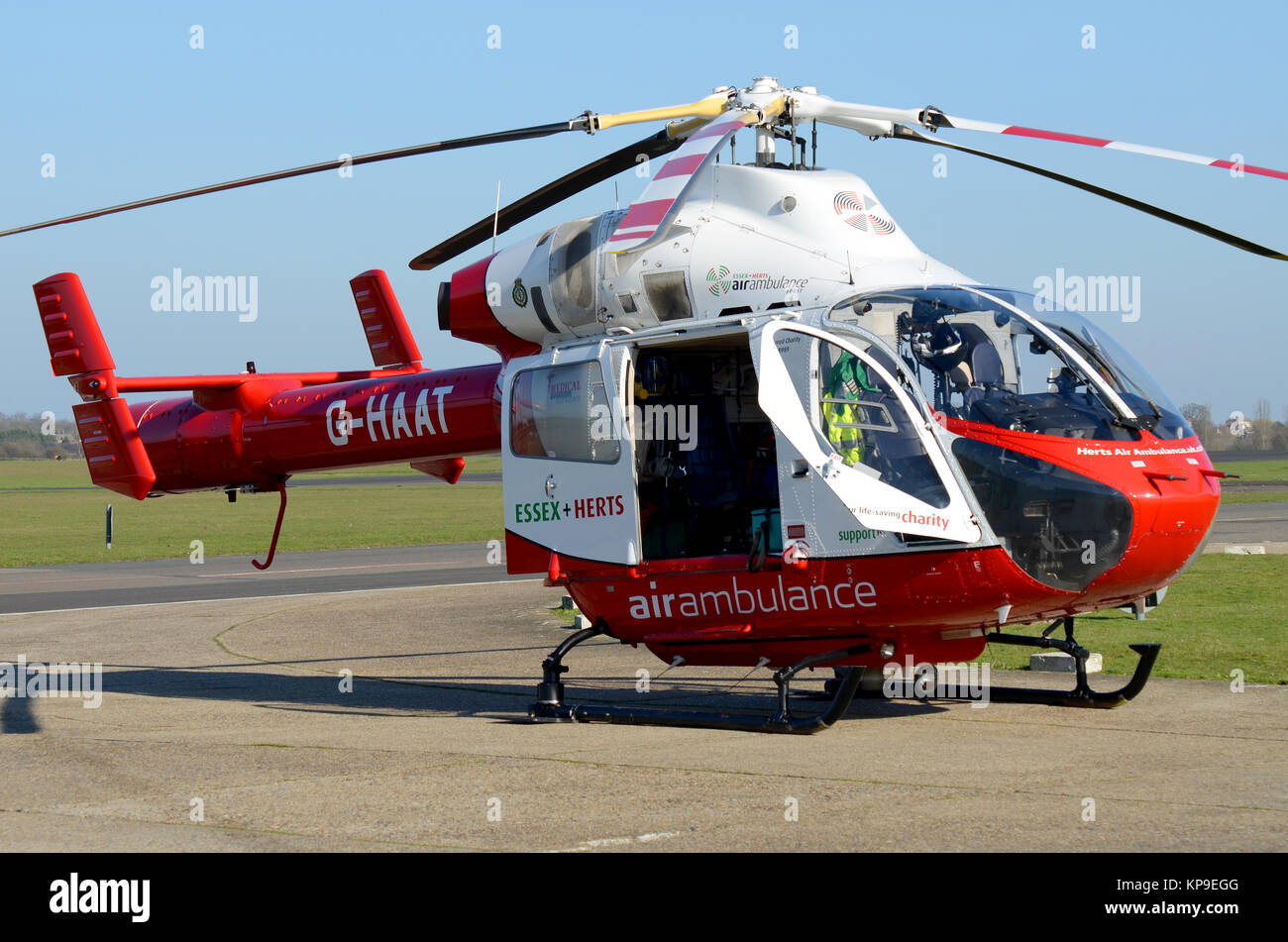 Essex and Herts Air Ambulance MD 900 Explorer G-HAAT helicopter sitting ready on alert at North Weald Airfield, Essex, UK Stock Photo