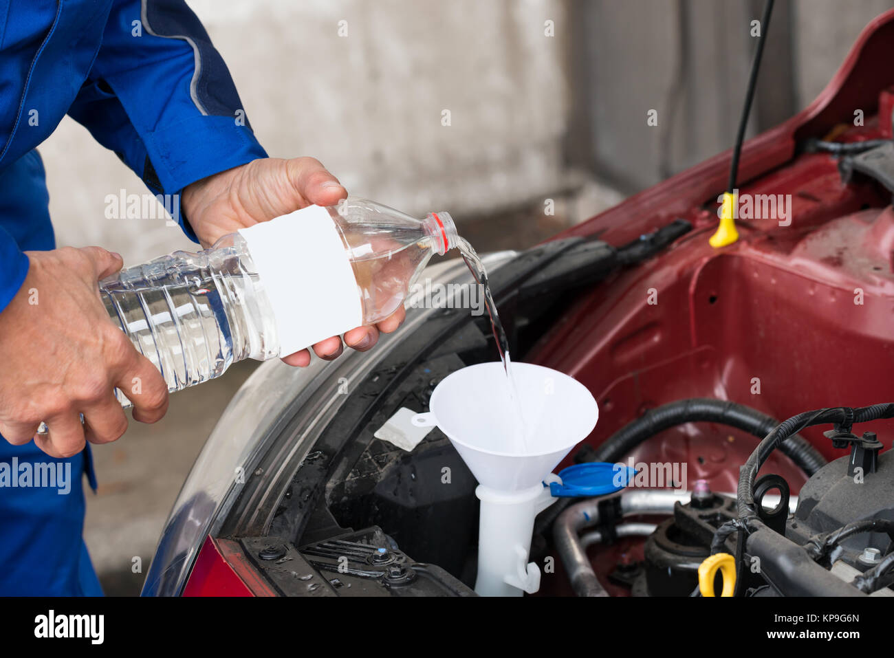Worker Pouring Water Into Windshield Water Tank Stock Photo Alamy
