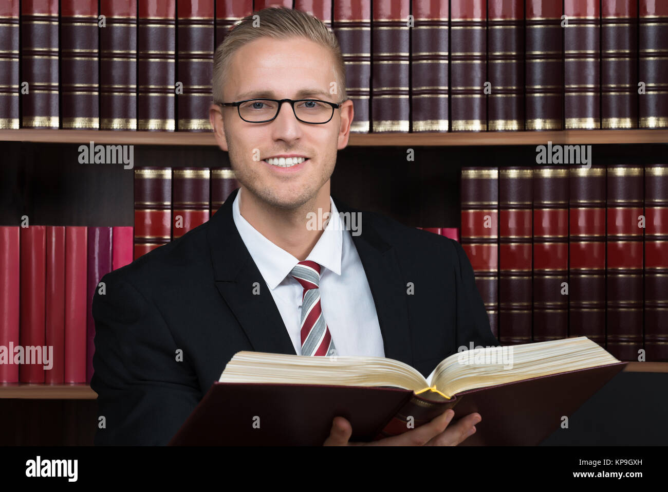 Lawyer Reading Book At Courtroom Stock Photo