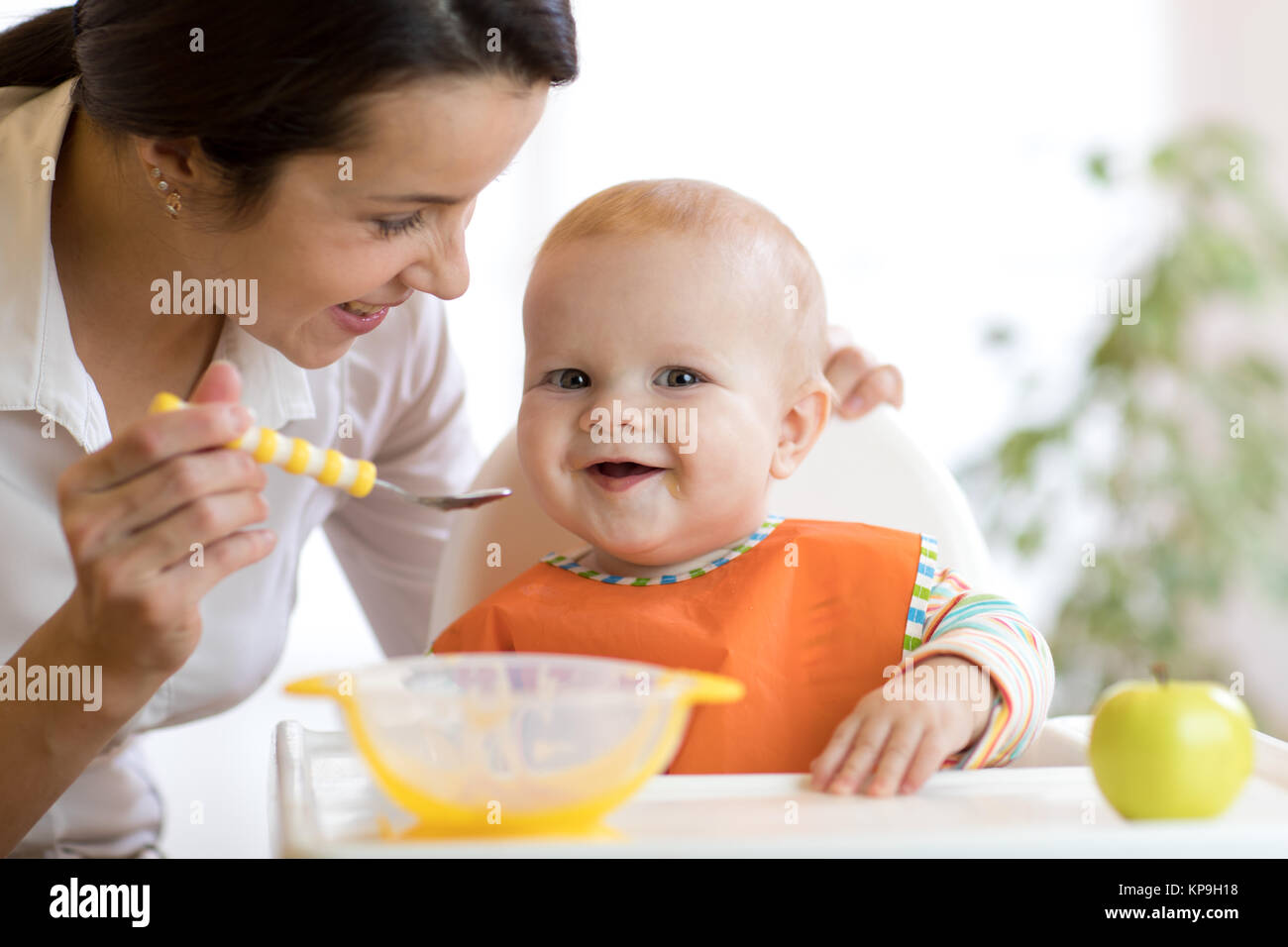 mother feeding her baby