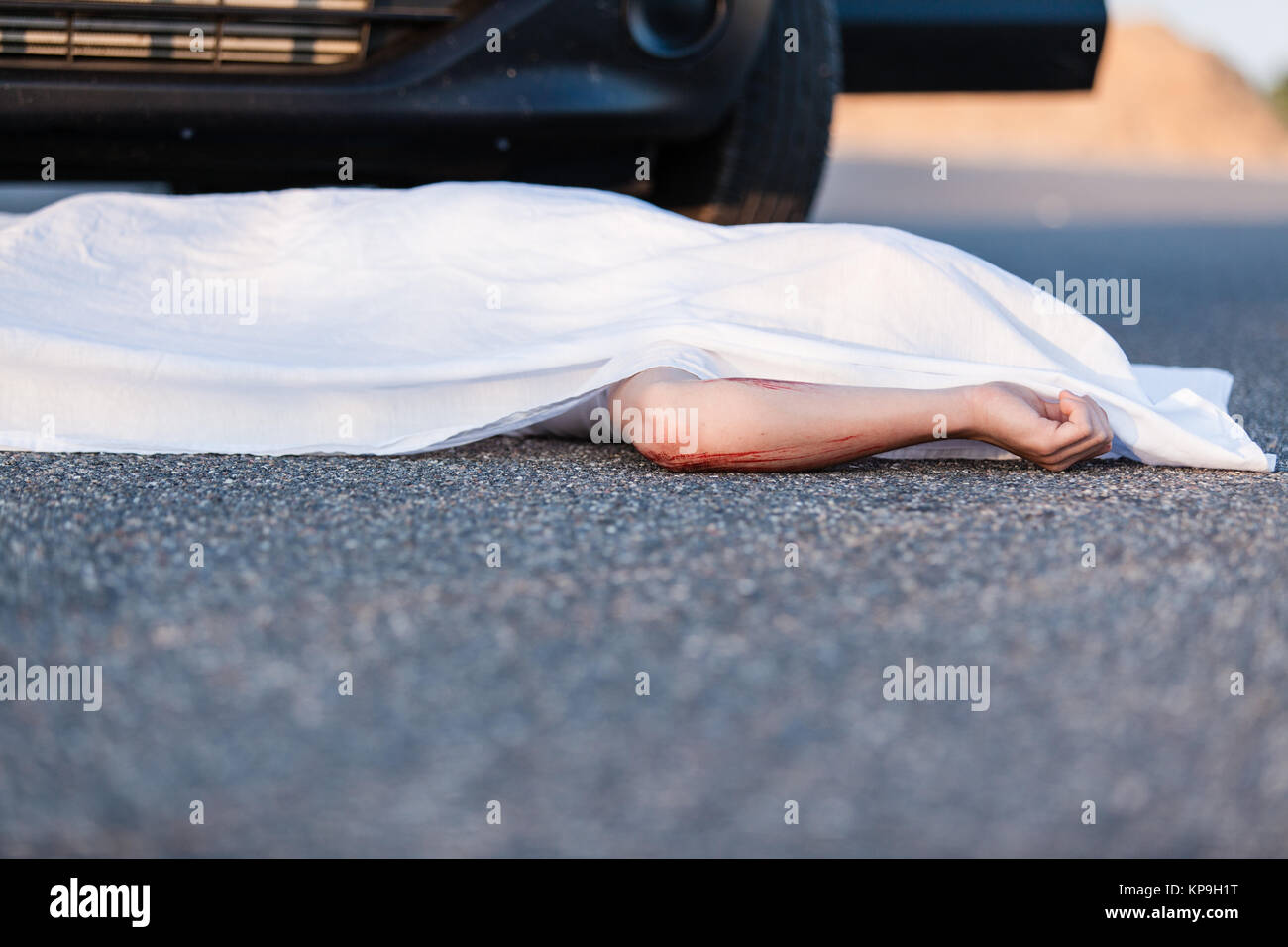 Body of a young child covered by a sheet Stock Photo