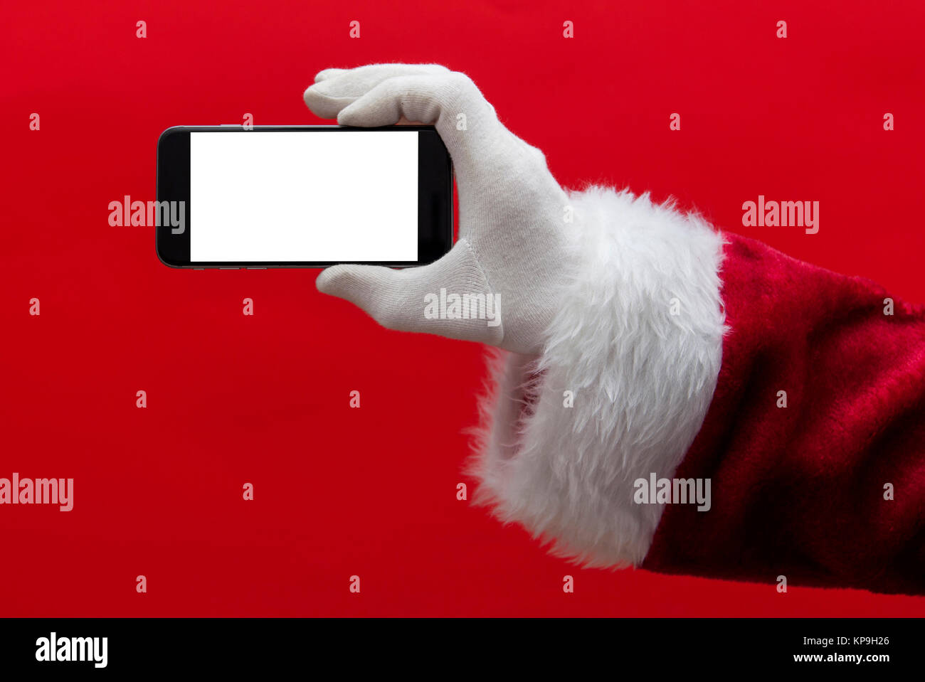 Santa Claus hand holding a smartphone with a blank screen Stock Photo ...