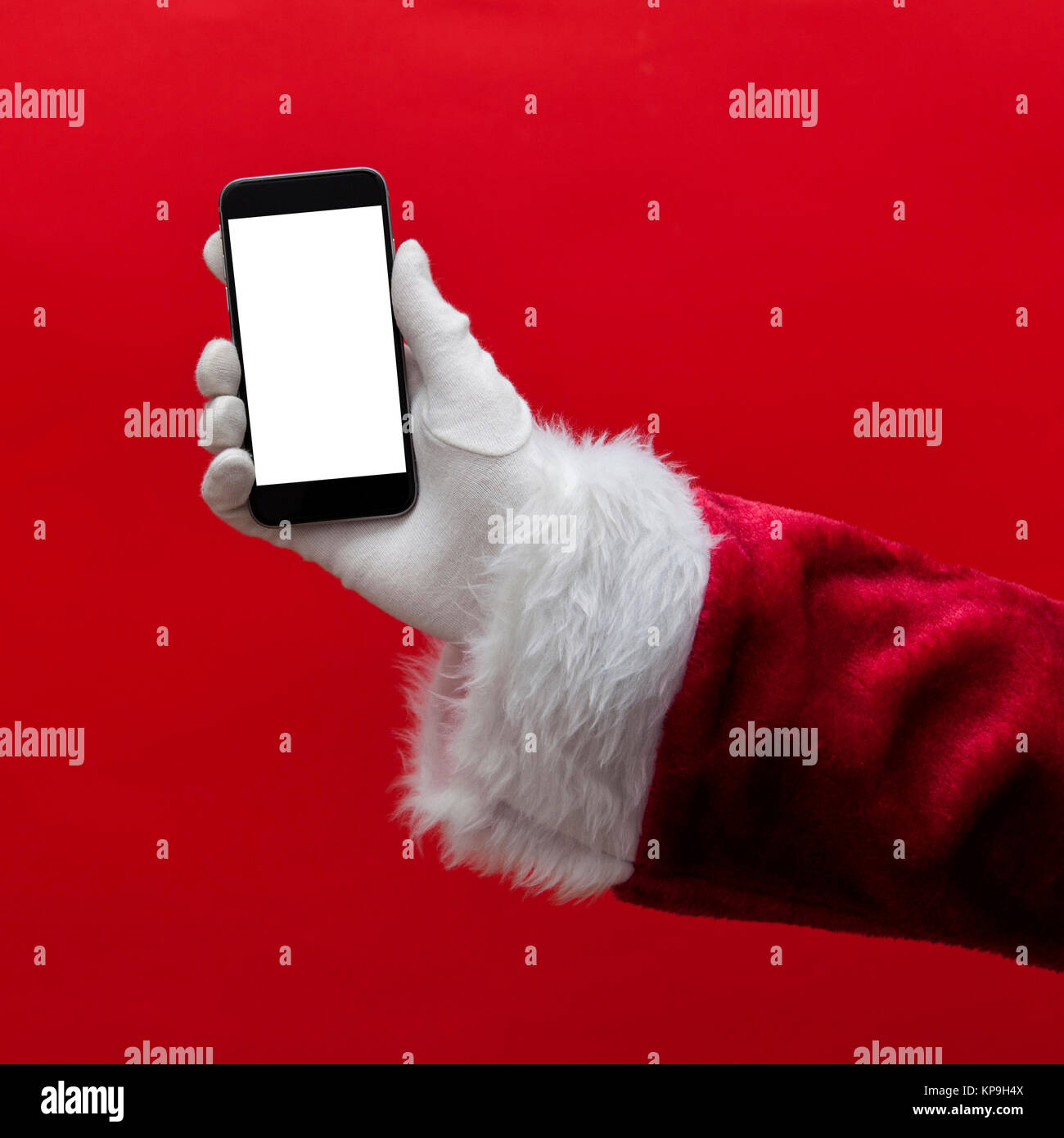 Santa Claus hand holding a smartphone with a blank screen Stock Photo ...