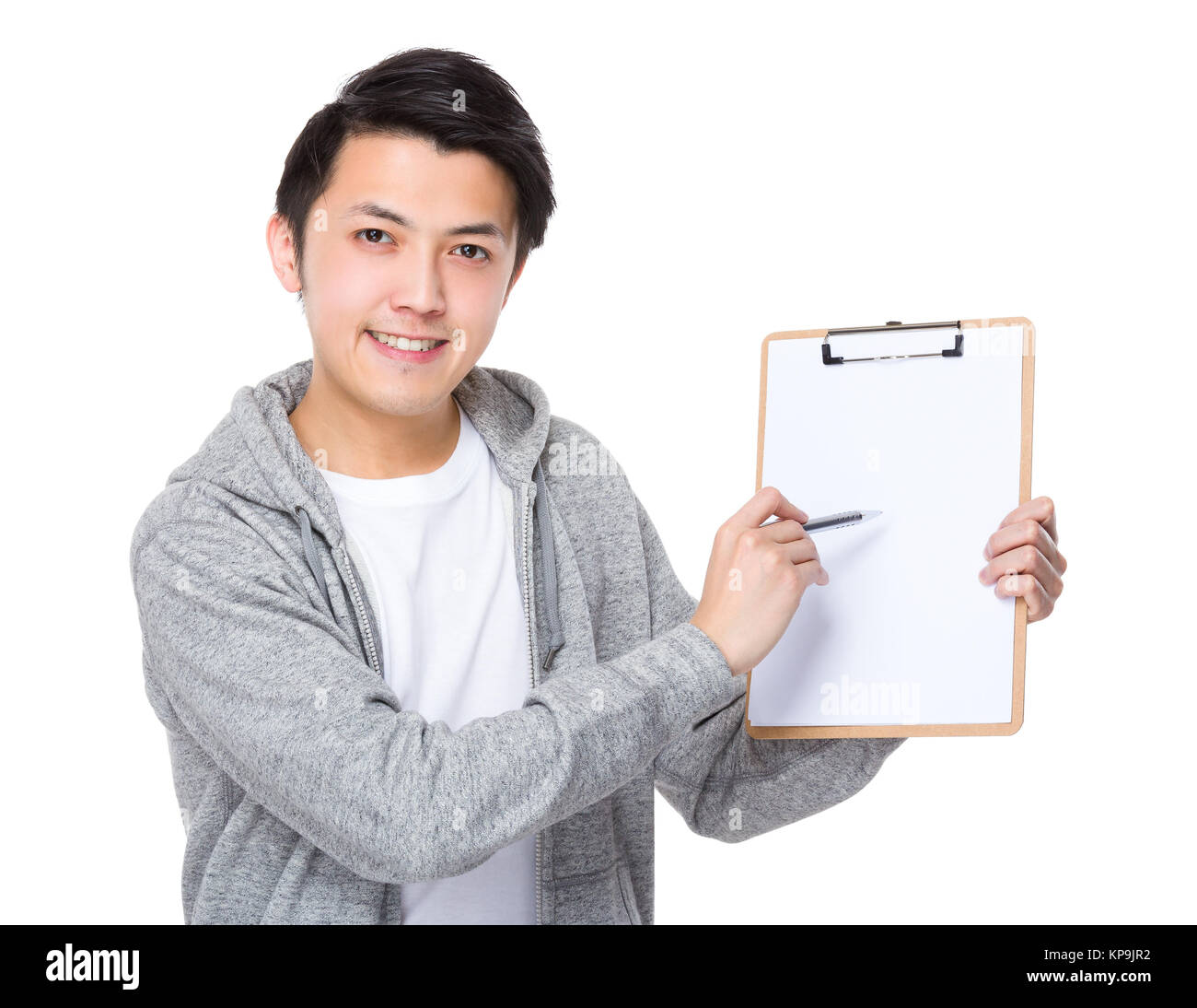 Asian man with pen point to clipboard Stock Photo - Alamy