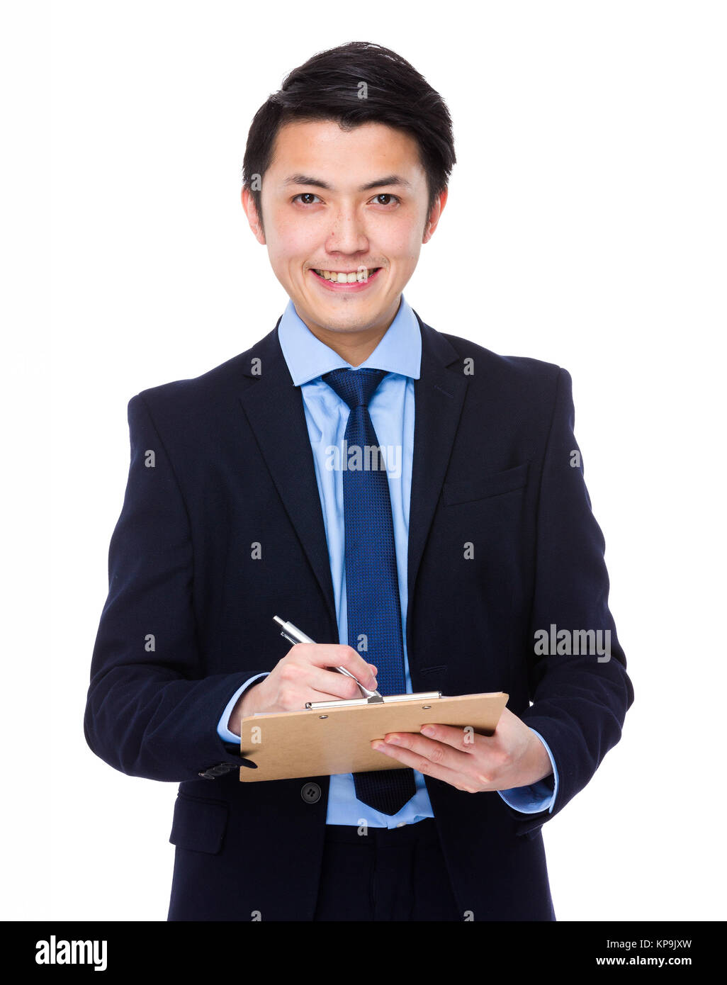 Asian young businessman write on clipboard Stock Photo - Alamy