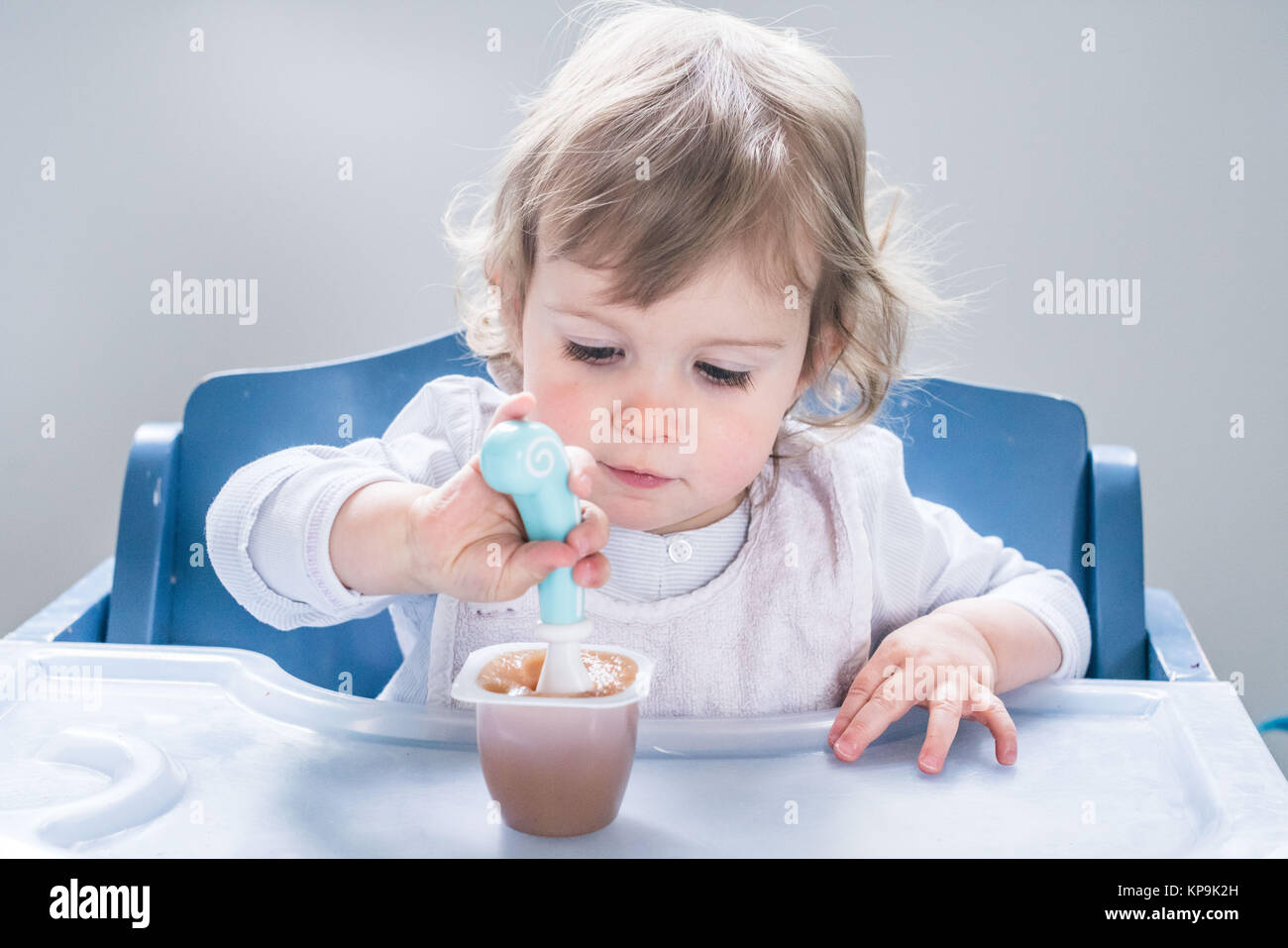 16 months old girl eating a dessert Stock Photo - Alamy